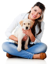 Woman with a little puppy - isolated over a white background